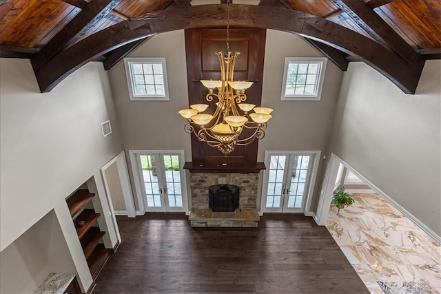 4465 Champagne Dr, Springdale, AR 72764 - unfurnished living room featuring french doors, a chandelier, plenty of natural light, high vaulted ceiling, and wood ceiling with exposed beams