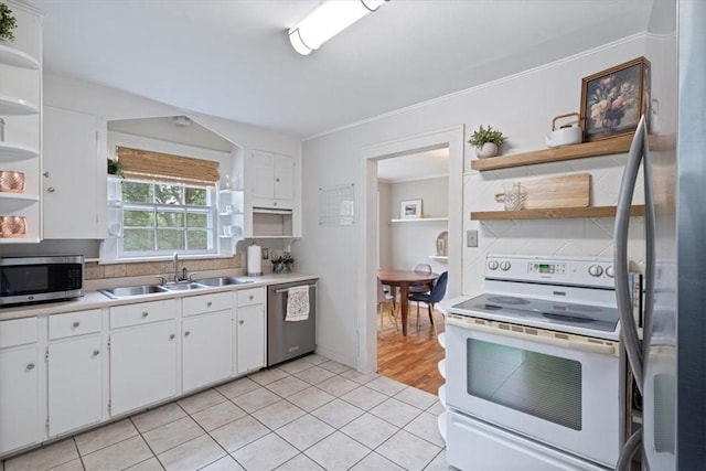 626 Ash St, Fayetteville, AR 72703 - kitchen with open shelves, appliances with stainless steel finishes, a sink, white cabinetry, and crown molding