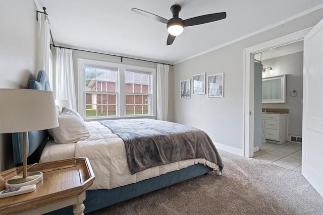 626 Ash St, Fayetteville, AR 72703 - bedroom featuring light carpet, ornamental molding, ensuite bath, a ceiling fan, and baseboards