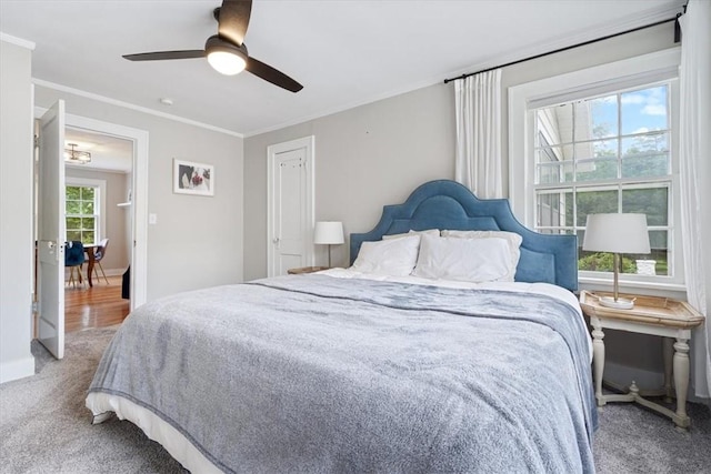 626 Ash St, Fayetteville, AR 72703 - bedroom with carpet, crown molding, a ceiling fan, and baseboards