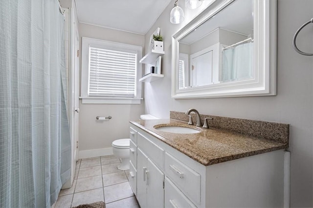 626 Ash St, Fayetteville, AR 72703 - full bathroom with tile patterned flooring, vanity, toilet, baseboards, and a shower with shower curtain