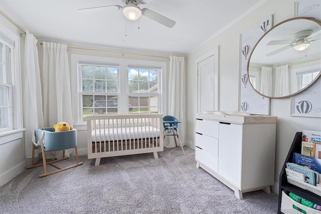 626 Ash St, Fayetteville, AR 72703 - bedroom with carpet flooring, crown molding, a ceiling fan, and a nursery area