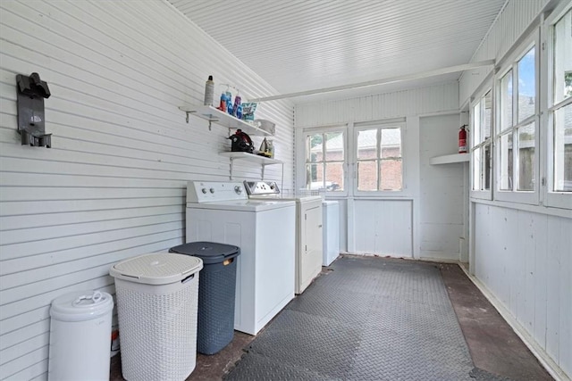 626 Ash St, Fayetteville, AR 72703 - laundry room with washer and clothes dryer and wooden walls