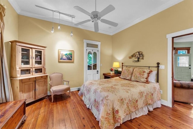 11 Hilton St, Eureka Springs, AR 72632 - bedroom with light wood-style floors, ornamental molding, track lighting, and a ceiling fan