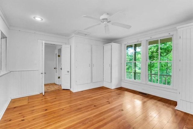 11 Hilton St, Eureka Springs, AR 72632 - spare room with light wood-style floors, ornamental molding, and a ceiling fan