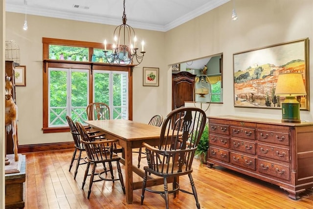 11 Hilton St, Eureka Springs, AR 72632 - dining space with a chandelier, light wood-style floors, and ornamental molding