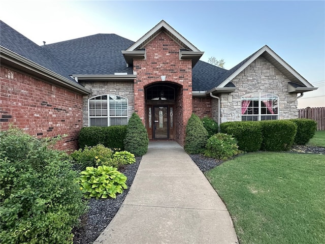 5749 S Chanberry Ln, Rogers, AR 72758 - view of front of house with stone siding and a shingled roof