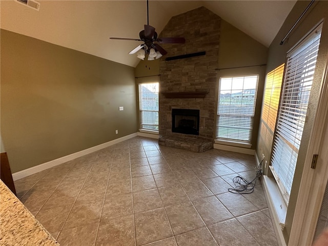 5749 S Chanberry Ln, Rogers, AR 72758 - unfurnished living room featuring a ceiling fan, tile patterned flooring, a stone fireplace, high vaulted ceiling, and baseboards