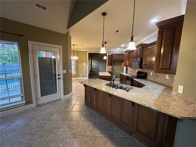 5749 S Chanberry Ln, Rogers, AR 72758 - kitchen with stainless steel microwave, black electric range, a sink, a peninsula, and backsplash