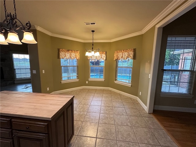 5749 S Chanberry Ln, Rogers, AR 72758 - unfurnished dining area featuring a chandelier, crown molding, baseboards, and light tile patterned floors