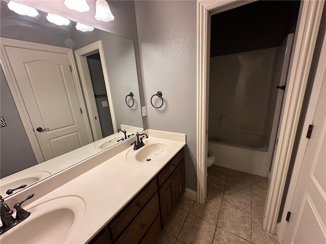5749 S Chanberry Ln, Rogers, AR 72758 - bathroom with double vanity, toilet, tile patterned flooring, and shower / bathtub combination