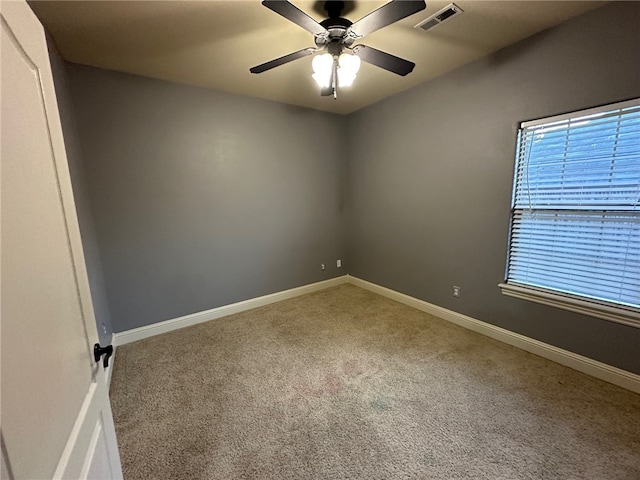 5749 S Chanberry Ln, Rogers, AR 72758 - unfurnished room with carpet floors, baseboards, ceiling fan, and healthy amount of natural light