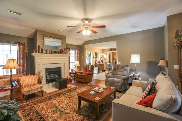 925 Lowell Ave, Cave Springs, AR 72718 - living area with a ceiling fan, healthy amount of natural light, wood finished floors, a tile fireplace, and lofted ceiling