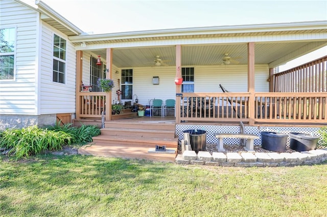 925 Lowell Ave, Cave Springs, AR 72718 - wooden porch featuring ceiling fan and a yard
