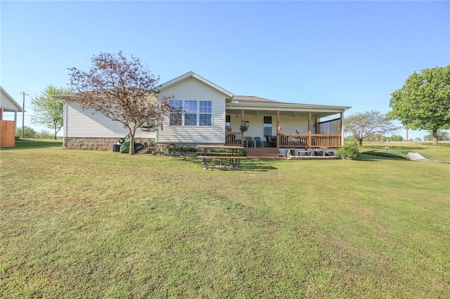 925 Lowell Ave, Cave Springs, AR 72718 - rear view of property featuring a yard and a porch