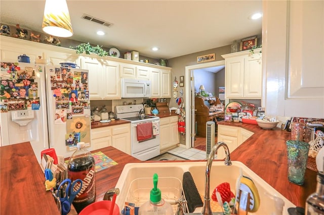 925 Lowell Ave, Cave Springs, AR 72718 - kitchen with white appliances, a sink, butcher block countertops, recessed lighting, and white cabinetry