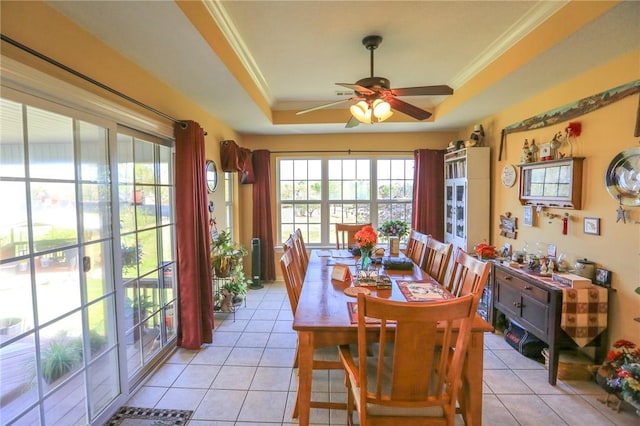 925 Lowell Ave, Cave Springs, AR 72718 - dining area with a raised ceiling, ceiling fan, light tile patterned flooring, and ornamental molding