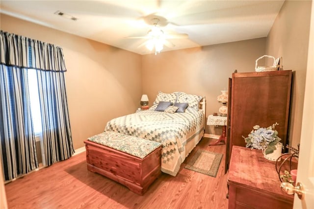 925 Lowell Ave, Cave Springs, AR 72718 - bedroom featuring light wood-type flooring, a ceiling fan, and baseboards