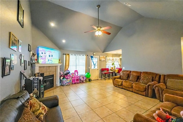 814 Colley St, Lowell, AR 72745 - living room with light tile patterned flooring, a ceiling fan, a tiled fireplace, high vaulted ceiling, and recessed lighting