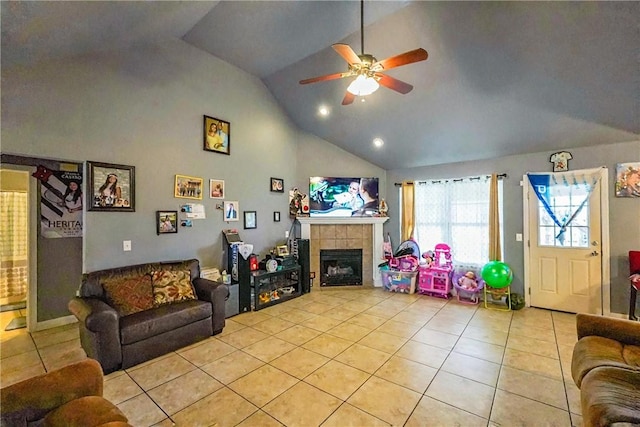814 Colley St, Lowell, AR 72745 - living area with light tile patterned floors, a ceiling fan, a tiled fireplace, high vaulted ceiling, and recessed lighting