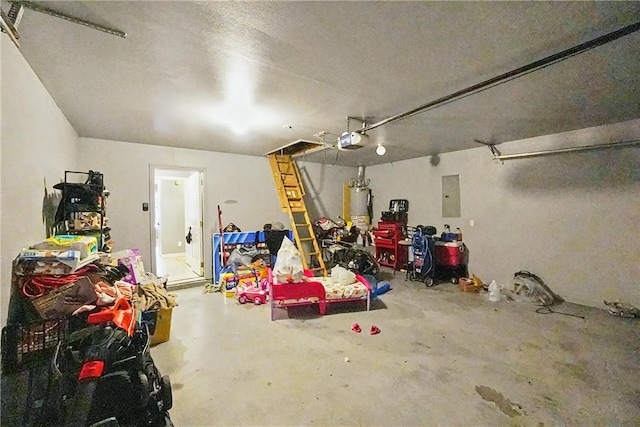 814 Colley St, Lowell, AR 72745 - garage featuring electric panel, gas water heater, and a garage door opener