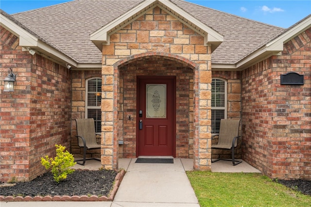 1503 W Kelley Dr, Rogers, AR 72756 - doorway to property featuring a shingled roof and brick siding