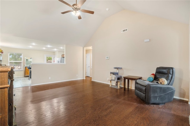 1503 W Kelley Dr, Rogers, AR 72756 - living area with a ceiling fan, wood finished floors, high vaulted ceiling, and baseboards