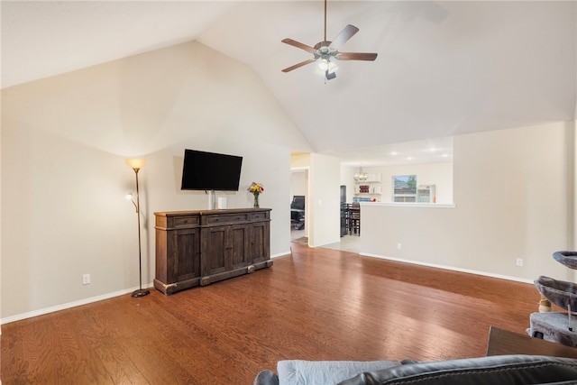 1503 W Kelley Dr, Rogers, AR 72756 - living room with ceiling fan, wood finished floors, high vaulted ceiling, and baseboards