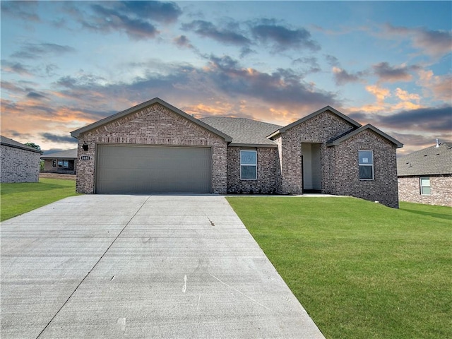 200 Greer St, Pea Ridge, AR 72751 - ranch-style home featuring driveway, a front yard, an attached garage, brick siding, and roof with shingles