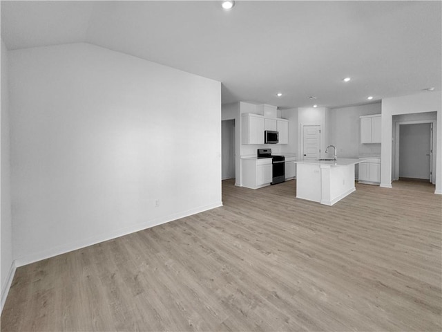 200 Greer St, Pea Ridge, AR 72751 - kitchen featuring range, stainless steel microwave, a sink, open floor plan, and recessed lighting