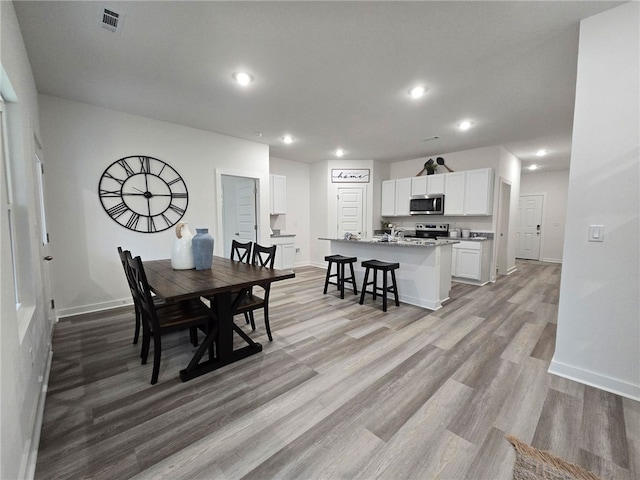 112 Greer St, Pea Ridge, AR 72751 - dining space with baseboards, light wood finished floors, and recessed lighting