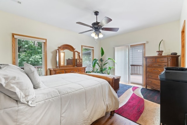4 Torrido Ln, Bella Vista, AR 72715 - bedroom with access to outside, multiple windows, wood finished floors, and a ceiling fan