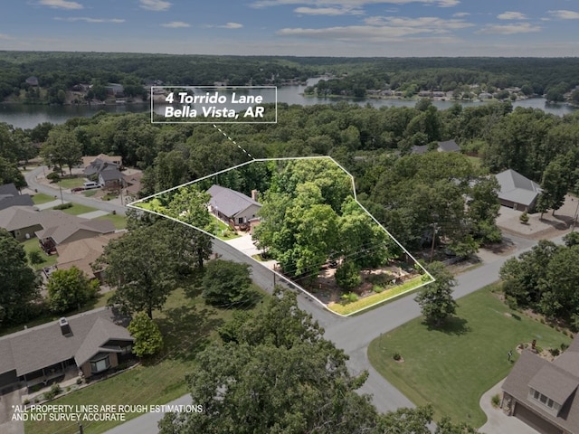 4 Torrido Ln, Bella Vista, AR 72715 - aerial view of property and surrounding area featuring a nearby body of water, property parcel outlined, and a heavily wooded area