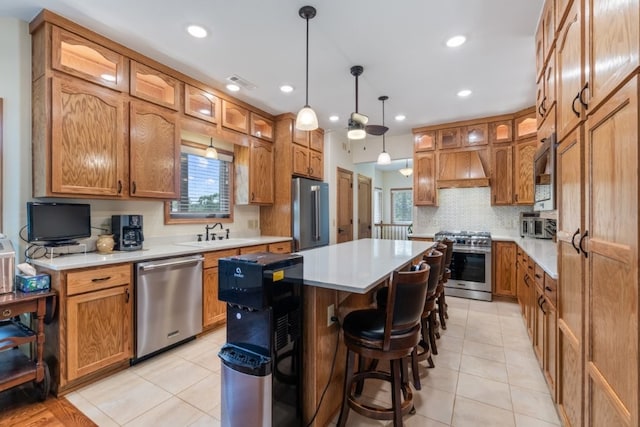 4 Torrido Ln, Bella Vista, AR 72715 - kitchen with stainless steel appliances, a center island, a sink, custom exhaust hood, and glass insert cabinets
