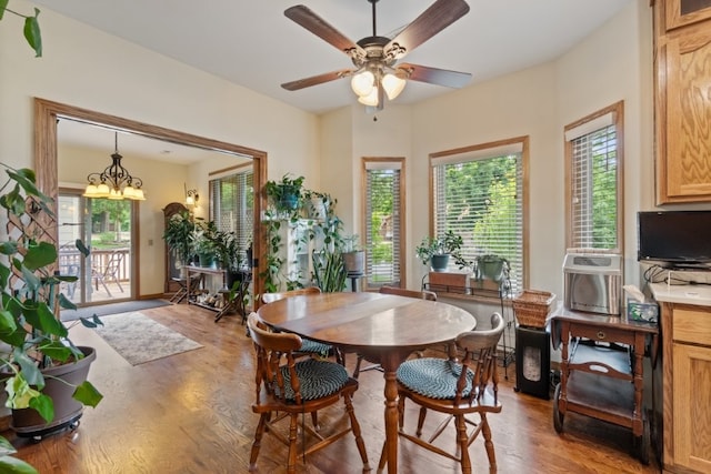 4 Torrido Ln, Bella Vista, AR 72715 - dining area with light wood-style floors, plenty of natural light, ceiling fan, and a chandelier