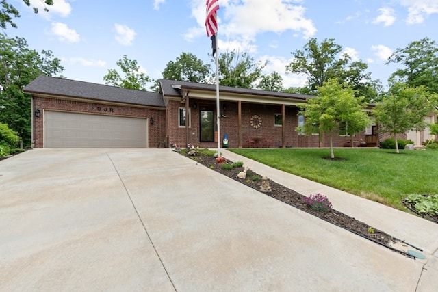 4 Torrido Ln, Bella Vista, AR 72715 - view of front of property featuring driveway, brick siding, a front lawn, and a garage