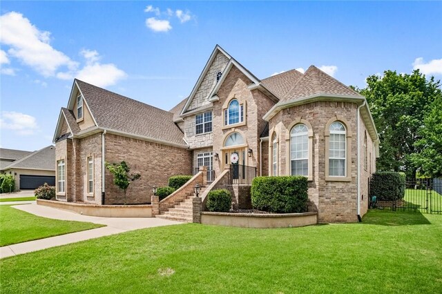 7 W Leiston Dr, Rogers, AR 72758 - view of front of property featuring brick siding, roof with shingles, and a garage