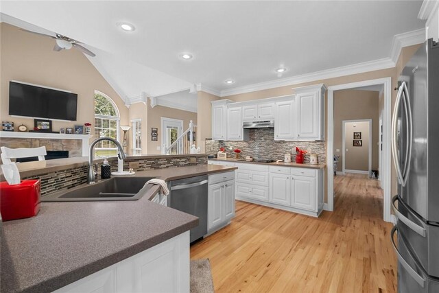 7 W Leiston Dr, Rogers, AR 72758 - kitchen with stainless steel appliances, a sink, backsplash, white cabinets, and ornamental molding