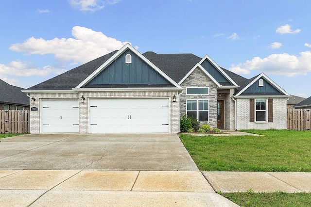 901 Carlock Dr, Pea Ridge, AR 72751 - view of front of home featuring an attached garage, concrete driveway, brick siding, and board and batten siding