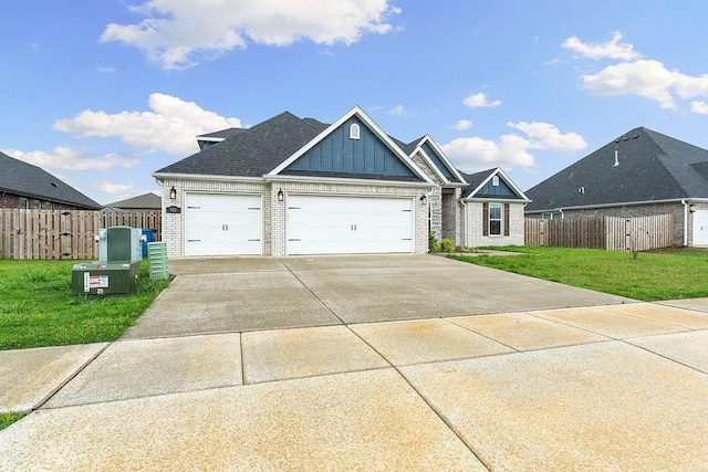 901 Carlock Dr, Pea Ridge, AR 72751 - view of front of house featuring board and batten siding, brick siding, a garage, and driveway