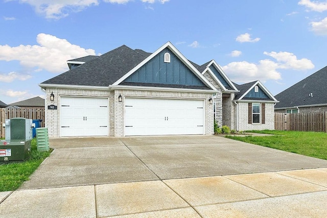 901 Carlock Dr, Pea Ridge, AR 72751 - view of front of home featuring board and batten siding, brick siding, an attached garage, concrete driveway, and a shingled roof