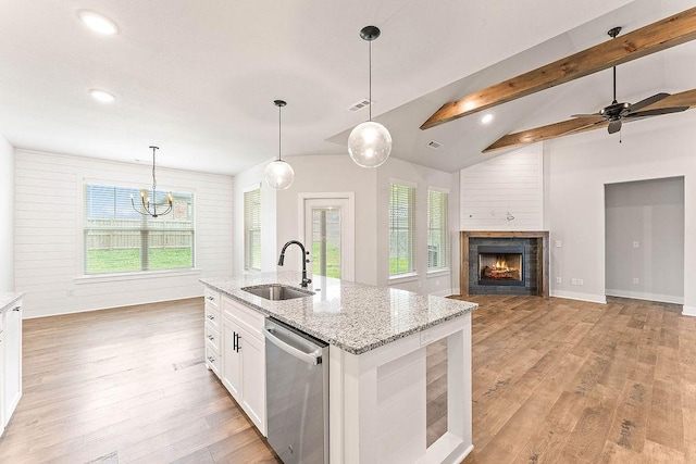 901 Carlock Dr, Pea Ridge, AR 72751 - kitchen with stainless steel dishwasher, a sink, plenty of natural light, light wood-style flooring, and recessed lighting