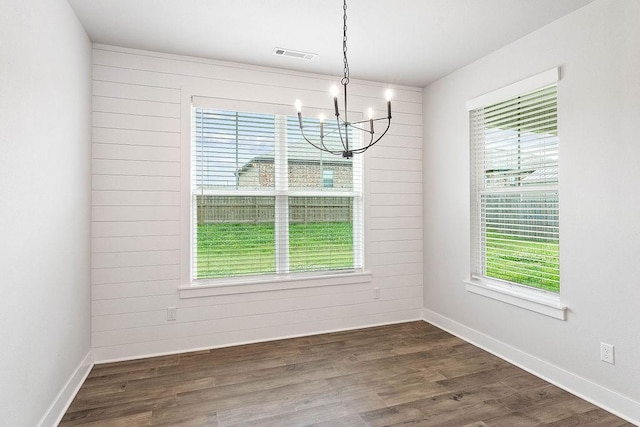 901 Carlock Dr, Pea Ridge, AR 72751 - unfurnished dining area featuring a chandelier, plenty of natural light, and dark wood-type flooring