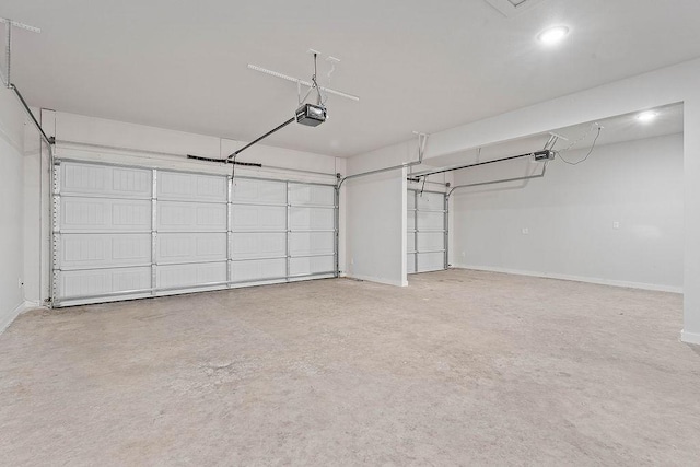 901 Carlock Dr, Pea Ridge, AR 72751 - garage with a garage door opener, baseboards, and recessed lighting