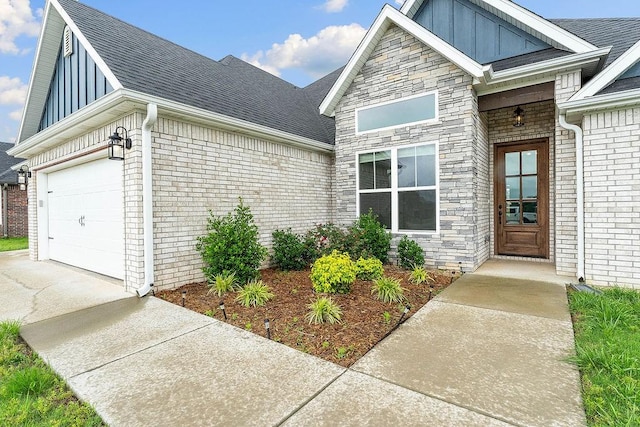 901 Carlock Dr, Pea Ridge, AR 72751 - view of front facade featuring board and batten siding, a garage, driveway, brick siding, and a shingled roof