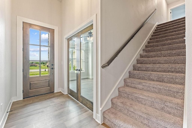 901 Carlock Dr, Pea Ridge, AR 72751 - foyer featuring stairs, healthy amount of natural light, wood finished floors, and baseboards