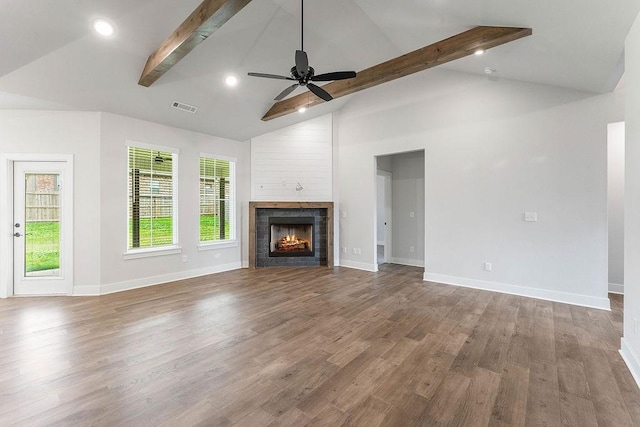 901 Carlock Dr, Pea Ridge, AR 72751 - unfurnished living room featuring beamed ceiling, baseboards, a ceiling fan, wood finished floors, and a lit fireplace
