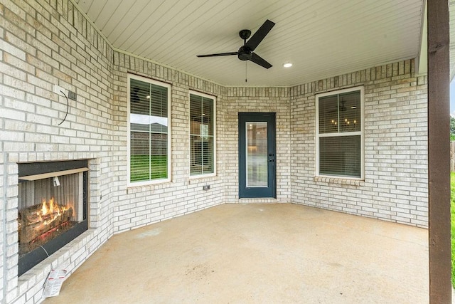 901 Carlock Dr, Pea Ridge, AR 72751 - view of patio / terrace featuring an outdoor brick fireplace and ceiling fan