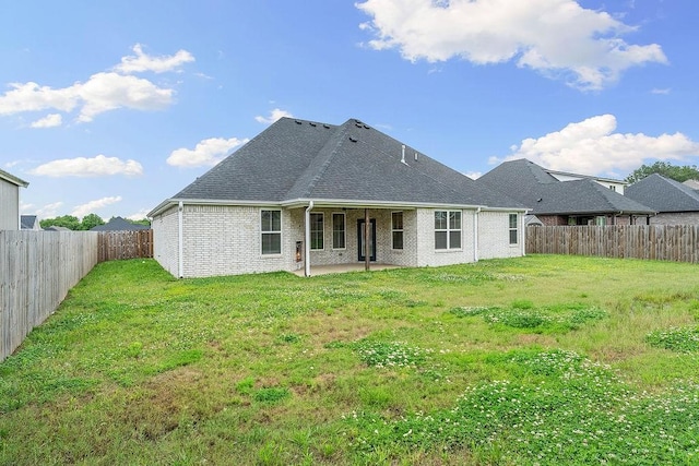 901 Carlock Dr, Pea Ridge, AR 72751 - rear view of house with a patio, brick siding, and a shingled roof