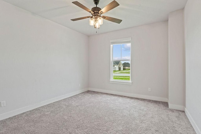901 Carlock Dr, Pea Ridge, AR 72751 - spare room with light carpet, baseboards, and ceiling fan